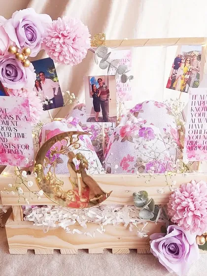 This anniversary hamper is all about celebrating memories. We filled a pinewood crate with photos of the couple, romantic quotes, and a beautiful moon-shaped decor piece.