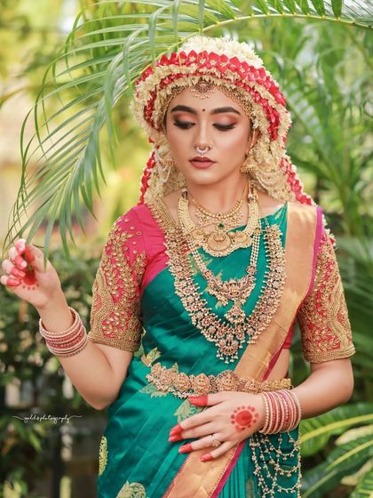 A series of images capturing the joy and beauty of a model in a traditional South Indian bridal look, complete with an elaborate floral headpiece. The focus is on her expressive smile and the rich textures of her attire.