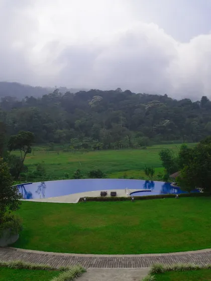 I believe that recharging means finding peace in beautiful surroundings. This infinity pool overlooking the misty hills of Coorg is just one example of the premium, serene accommodations I arrange for corporate offsites.