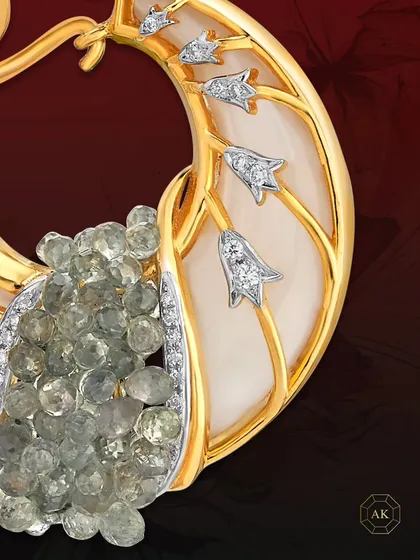 A one-of-a-kind earring from our collector's edition. It features Mother of Pearl adorned with intricate gold detailing, green onyx briolettes, and diamonds, inspired by organic beauty.