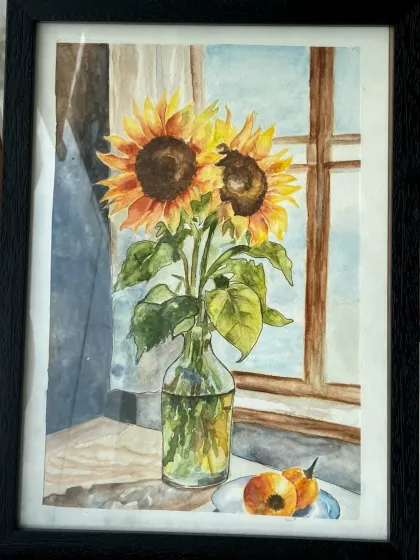 A lovely watercolor painting of sunflowers in a vase, created by a student. The light coming through the window is beautifully captured.