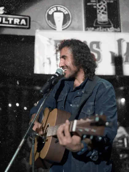 A smiling shot of Jas enjoying the jam session. It's not just a performance for us, we have just as much fun as the audience.