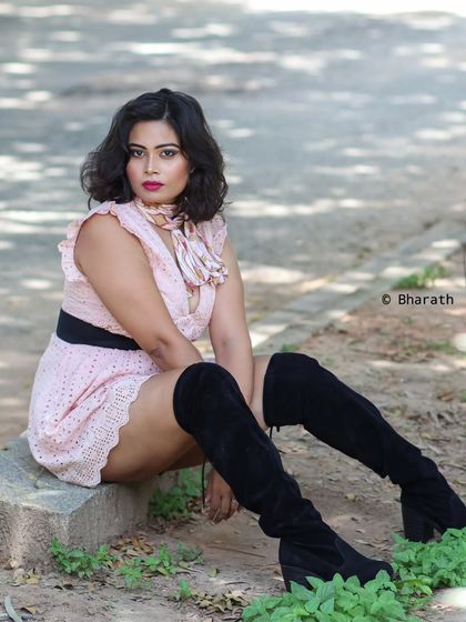 A seated portrait on a low wall in a park. This pose is relaxed and natural, perfect for a lifestyle session.