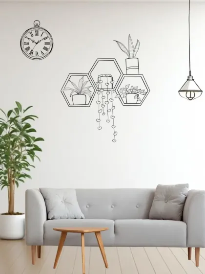 Next, we introduce shelving. This hexagonal shelf adds geometric interest and a place to display smaller plants and decor.