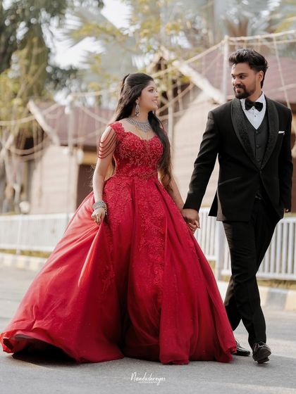 The grand walk as a newly married couple. This photo captures the elegance of their reception attire and the confident joy as they step into their future together.