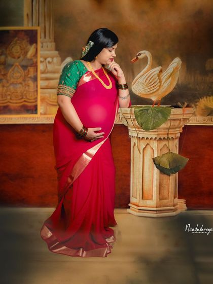 A similar pose to 116, this shot captures the mother's gentle interaction with the swan prop, creating a story of tenderness and beauty.
