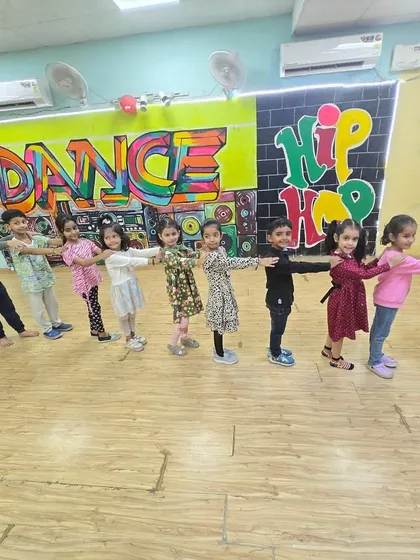 A train of happy dancers! We often incorporate fun formations like this into our choreography to teach teamwork and coordination in our classes for young children.