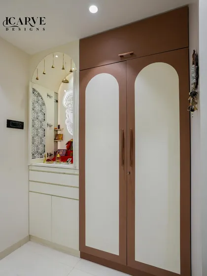 A detailed look at the storage and pooja unit adjacent to the dining area, showcasing our custom cabinetry work.