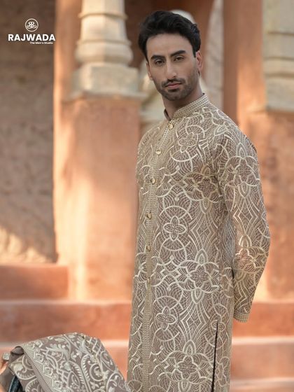 A close-up of the inner kurta of the beige Indo-Western set. The detailed embroidery on the kurta itself shows that no detail is overlooked in my creations.