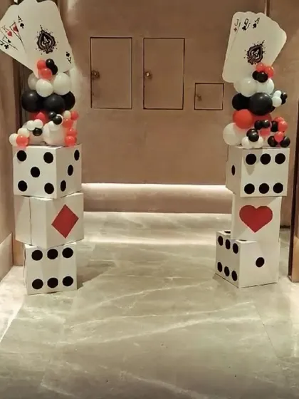 Our DIY card party dice panels are perfect for creating an instant party atmosphere. These easy-to-assemble props are great for flanking a doorway and welcoming guests to your casino night.