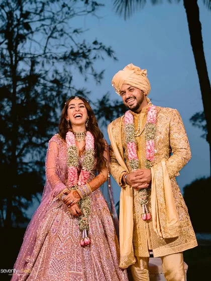 A moment of pure, unscripted laughter shared between the bride and groom right after their varmala ceremony in Goa.