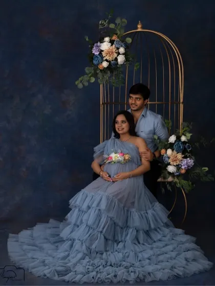 A beautiful portrait of a couple in our cage setup. The soft blue gown and floral arrangements create a dreamy and romantic atmosphere.