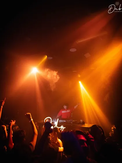 The stage at Dabo, bathed in orange light. The atmosphere was incredible, and the crowd was ready to party all night.