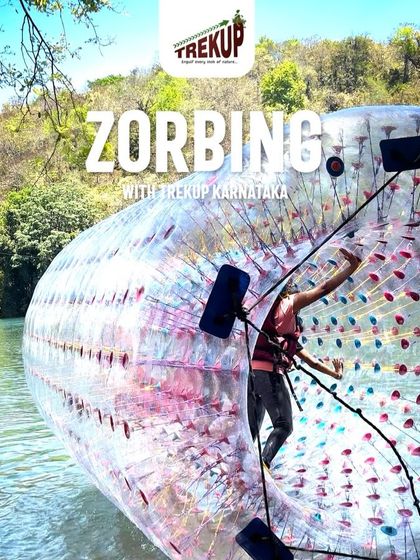 A trekker having fun inside a water zorbing ball in Dandeli. It's as fun as it looks!