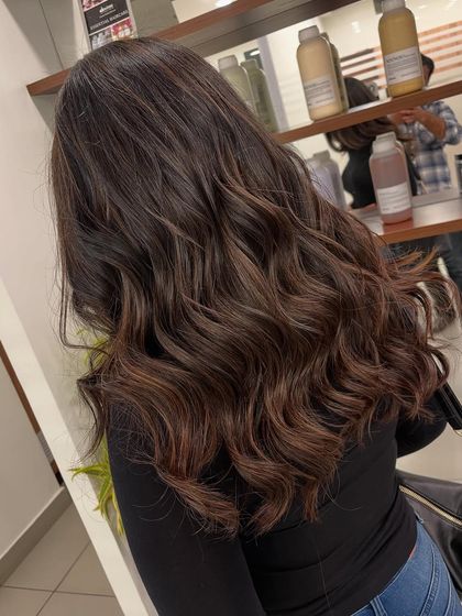 This angle shows how the balayage highlights are woven through the hair, creating a natural and textured look.