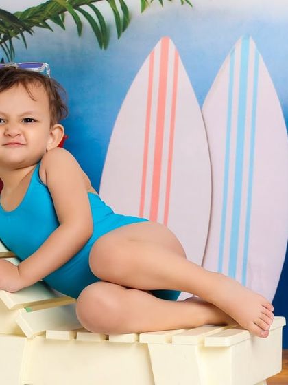 A funny face from the beach lounger. I love capturing these quirky, candid expressions that show a child's true character.