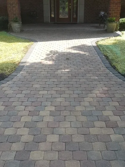A new paver walkway leading to the front door gives this home a fresh, clean entrance. The new sod on either side will fill in to complete the look.