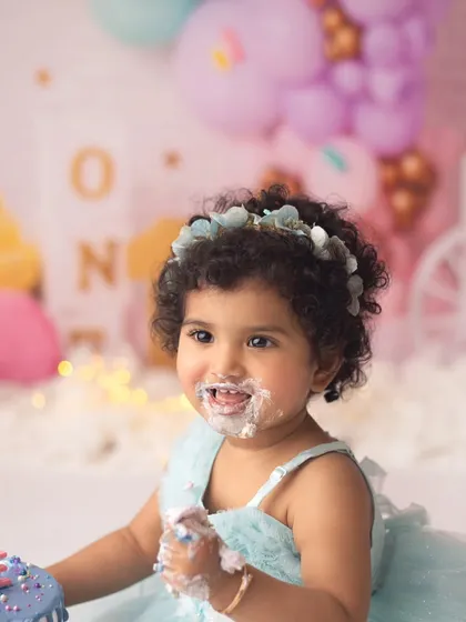 That sweet, frosting-covered face just melts my heart. This little one had the best time exploring her first birthday cake.