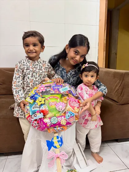 Seeing the smiles on these little faces is why I pour my heart into every creation. This giant lollipop hamper, filled with their favorite treats, was made for a special Rakhi celebration.
