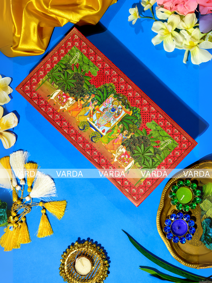 This gift box lid is adorned with a beautiful Pichwai art painting, depicting Shreenathji in a lush, natural setting. It’s a perfect choice for a culturally rich wedding invitation that celebrates traditional Indian art forms.