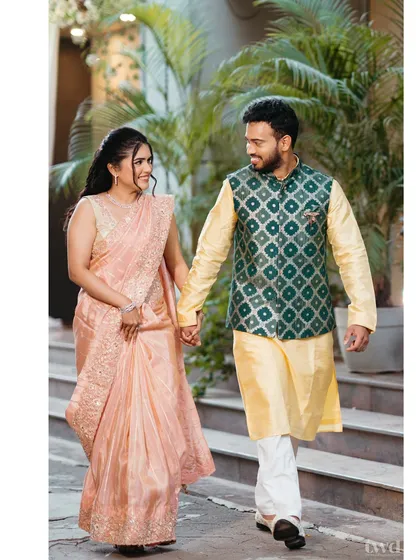 Rasika and Vedant taking a stroll during their engagement shoot. We aim for natural, comfortable portraits that reflect the couple's easy chemistry.