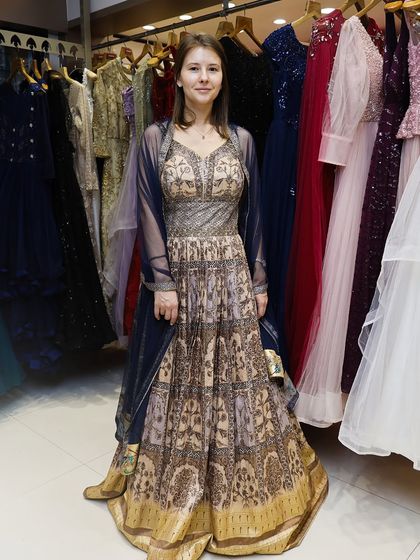 A full-length view of a client in an elegant, floor-length Anarkali-style rental, showcasing the diversity of my collection.
