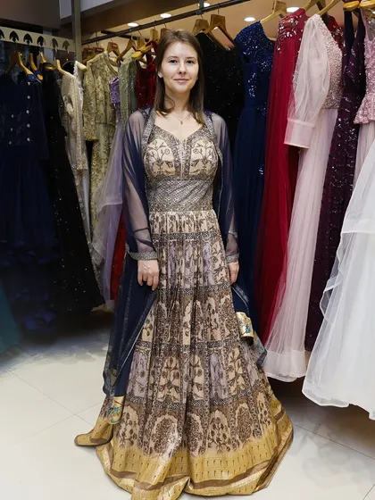 A full-length view of a client in an elegant, floor-length Anarkali-style rental, showcasing the diversity of my collection.