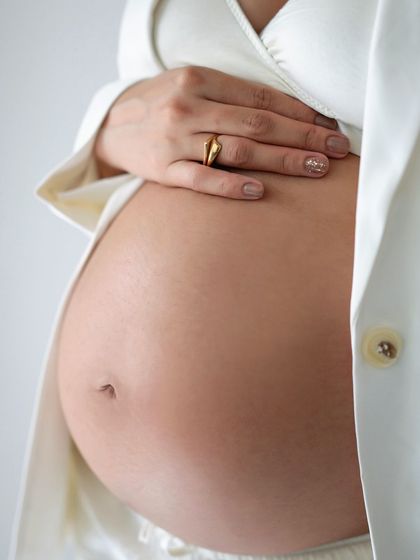 Another detail shot of a bare baby bump, highlighting the beauty of pregnancy.