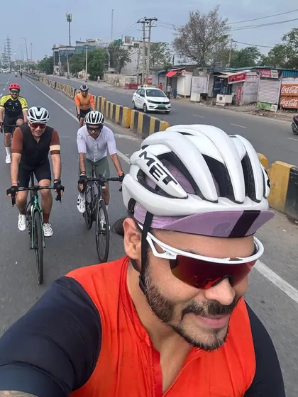 A selfie from the front of the pack, capturing the effort and fun of a group ride.