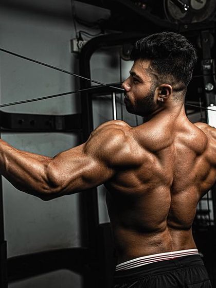 A powerful back shot. This is the result of countless hours spent pulling heavy weight with perfect form.