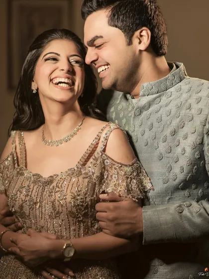 Pure, unadulterated laughter. This candid shot of Rohit and Garima is a perfect example of how we capture the real, joyful moments that define your relationship.