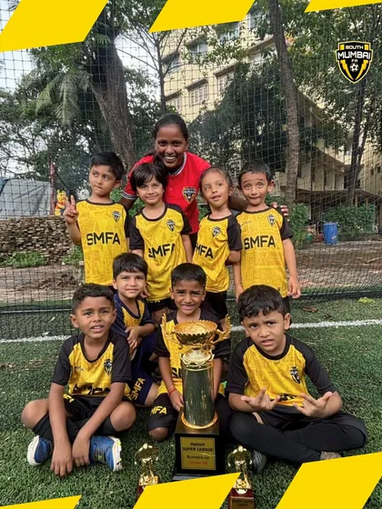 Another angle of our U6 champions. Seeing our youngest players hold a trophy reinforces our belief in starting early and building confidence from day one.