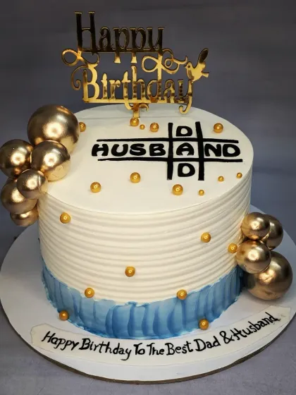 A fun crossword-style cake for the "Best Dad & Husband". This is a fresh pineapple cake with a creative design perfect for a family celebration.