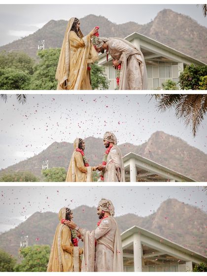 A beautiful sequence of the Varmala ceremony against the stunning backdrop of the Udaipur mountains, even as it started to rain.