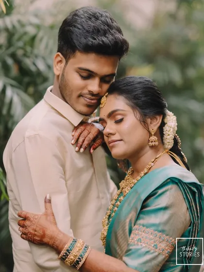An intimate and tender portrait of a couple in a close embrace, their eyes closed in a moment of peaceful connection.