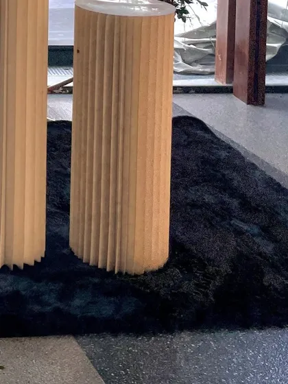 A close-up of the textured cylindrical plinths used for displaying props and the cake, showing the quality of the materials I use for my setups.