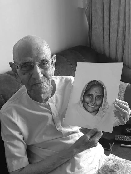 My fua holding the finished portrait of his mother. Capturing these family connections is a privilege.