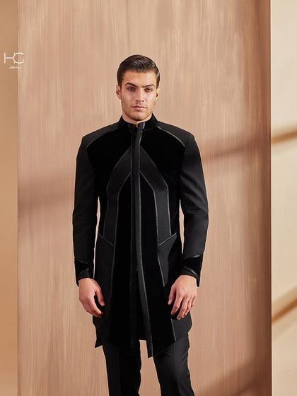 Here I explored blending fabrics and traditions. This piece combines rich velvet panels with a structured base, creating a modern achkan that is texturally rich and visually striking.