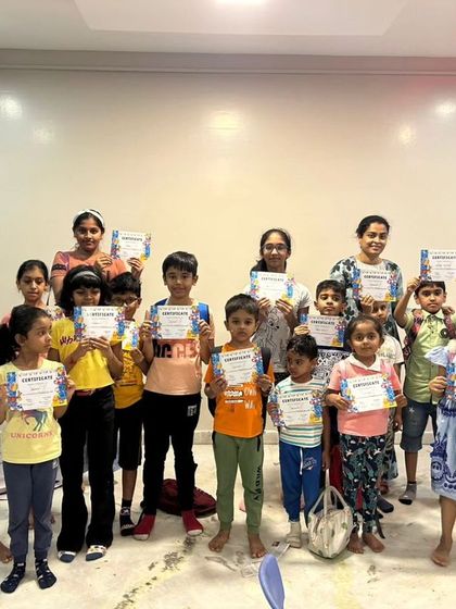 The full group of happy campers and instructors celebrating the end of a successful first batch of summer camp.