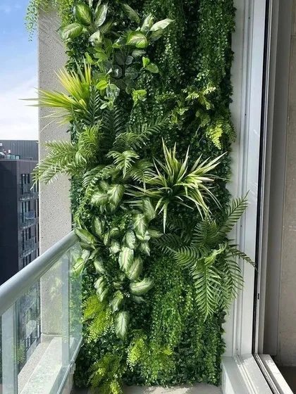 Even a small balcony can become a lush escape. We designed and installed this custom artificial vertical garden, creating a vibrant, maintenance-free wall of greenery that adds life and privacy to this urban apartment.