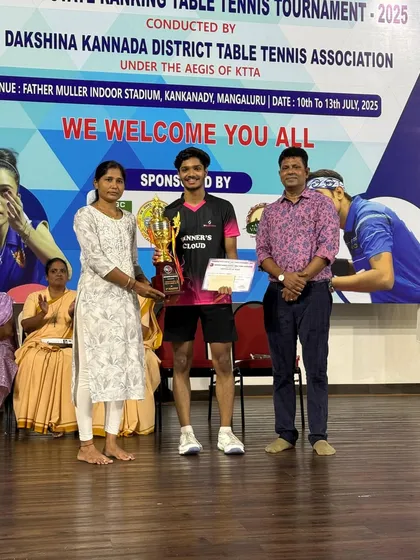 Shrikanth Kashyap receiving his trophy for securing 3rd Place in the Men's singles category at the 3rd Karnataka state ranking tournament in Mangalore.
