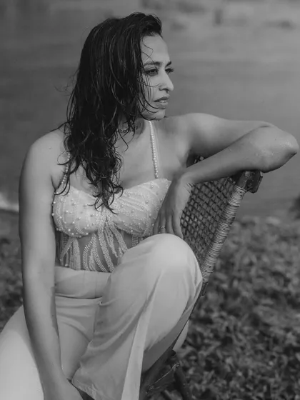 A stunning black and white portrait of Vandana by the water. This shot from her vow renewal shoot is moody and soulful, capturing her strength and beauty with an artistic touch.