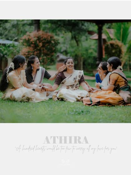 A beautiful portrait of the bride and her friends, with the name "Athira" and a sweet quote about love.