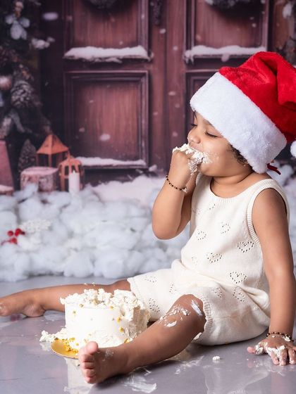A Christmas cake smash. This little Santa is enjoying a festive treat, combining two of my favorite sessions into one.