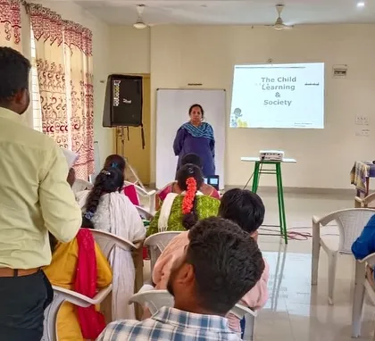 Our founder presenting on "The Child, Learning & Society" to a group of grassroots educators, emphasizing that children do not learn in isolation.