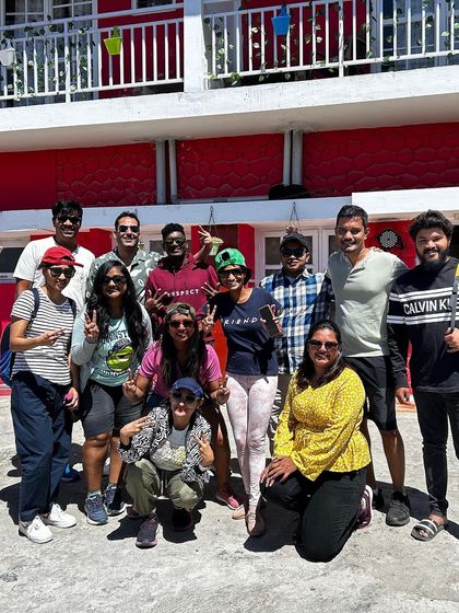 Our group posing together at a homestay. The bonds formed on our trips often start with shared meals and evening chats at our cozy accommodations.