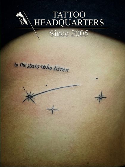A shooting star tattoo with the quote "to the stars who listen," a magical and literary-inspired piece.