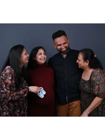 A sweet, candid moment during a family maternity session in the studio. I guide my clients into poses that feel natural, allowing for genuine interactions and smiles to shine through.