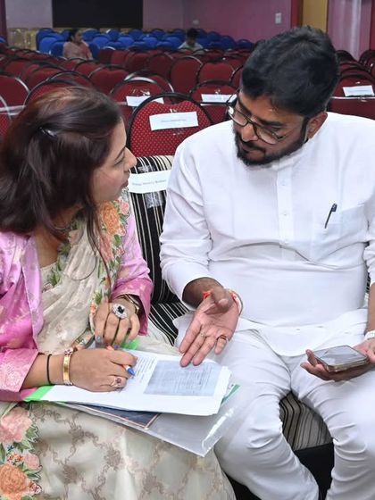 A pre-event briefing for the Pragya Samaj ceremony. I ensure I am perfectly aligned with the organizers to deliver a flawless hosting experience.