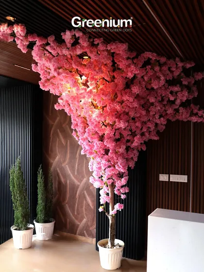 For a truly breathtaking statement piece, I design and install large-scale artificial trees like this stunning Cherry Blossom. It brings everlasting color and elegance to commercial spaces like cafes or large homes, with absolutely no maintenance required.